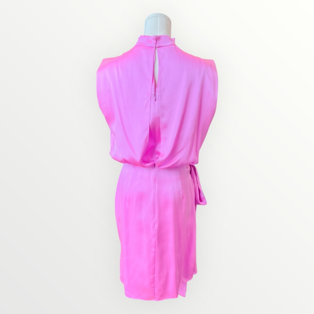 Pink dress on a mannequin against a white background