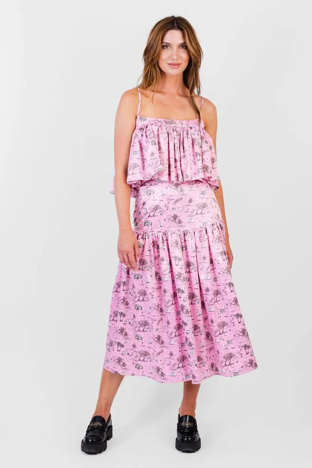 Woman wearing a pink floral dress on a white background