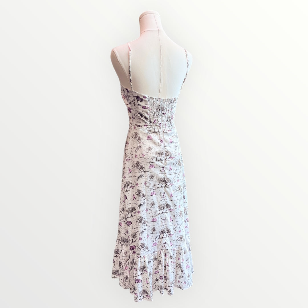 Floral dress on a mannequin against a white background