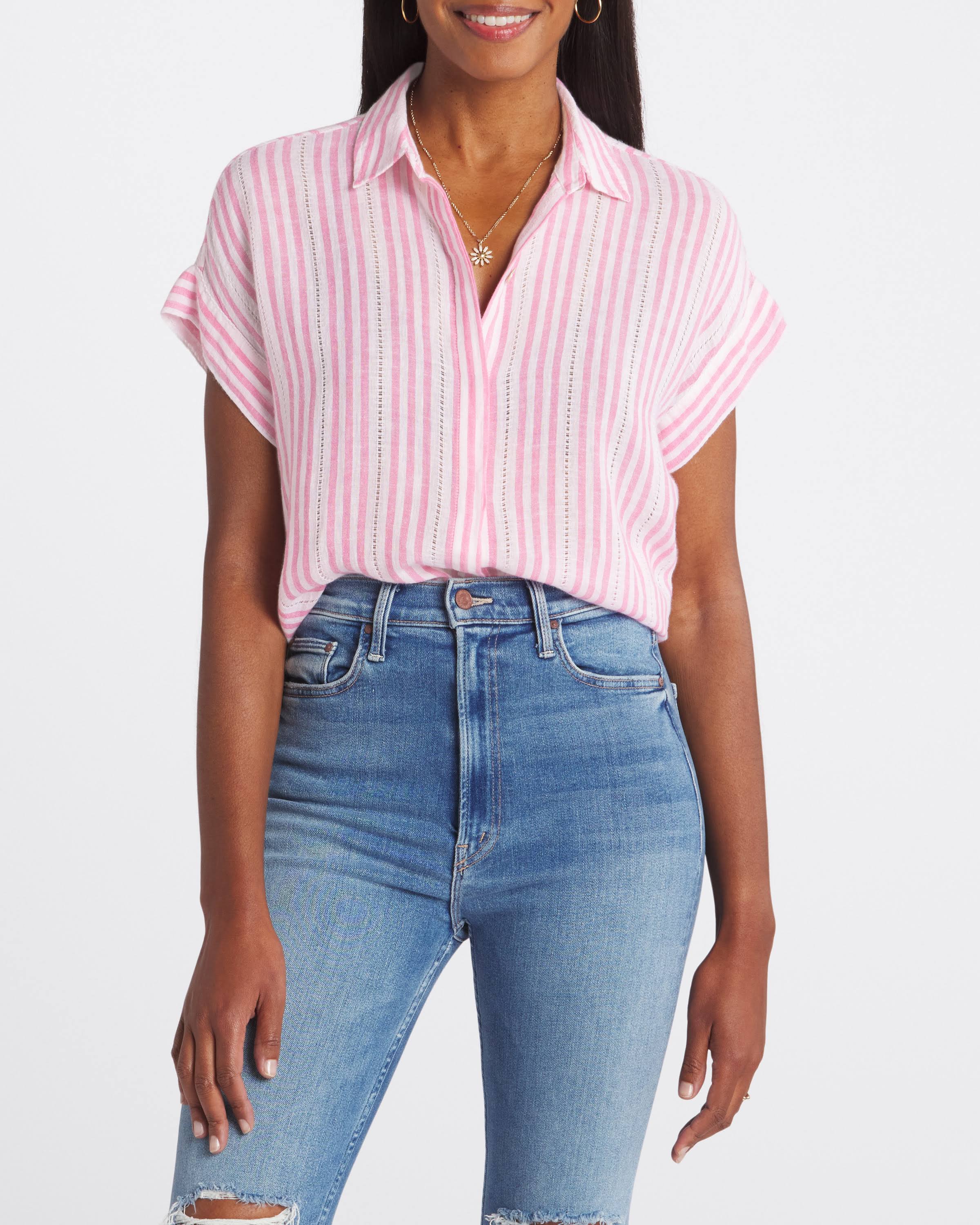 Person wearing a pink and white striped shirt and blue jeans on a white background