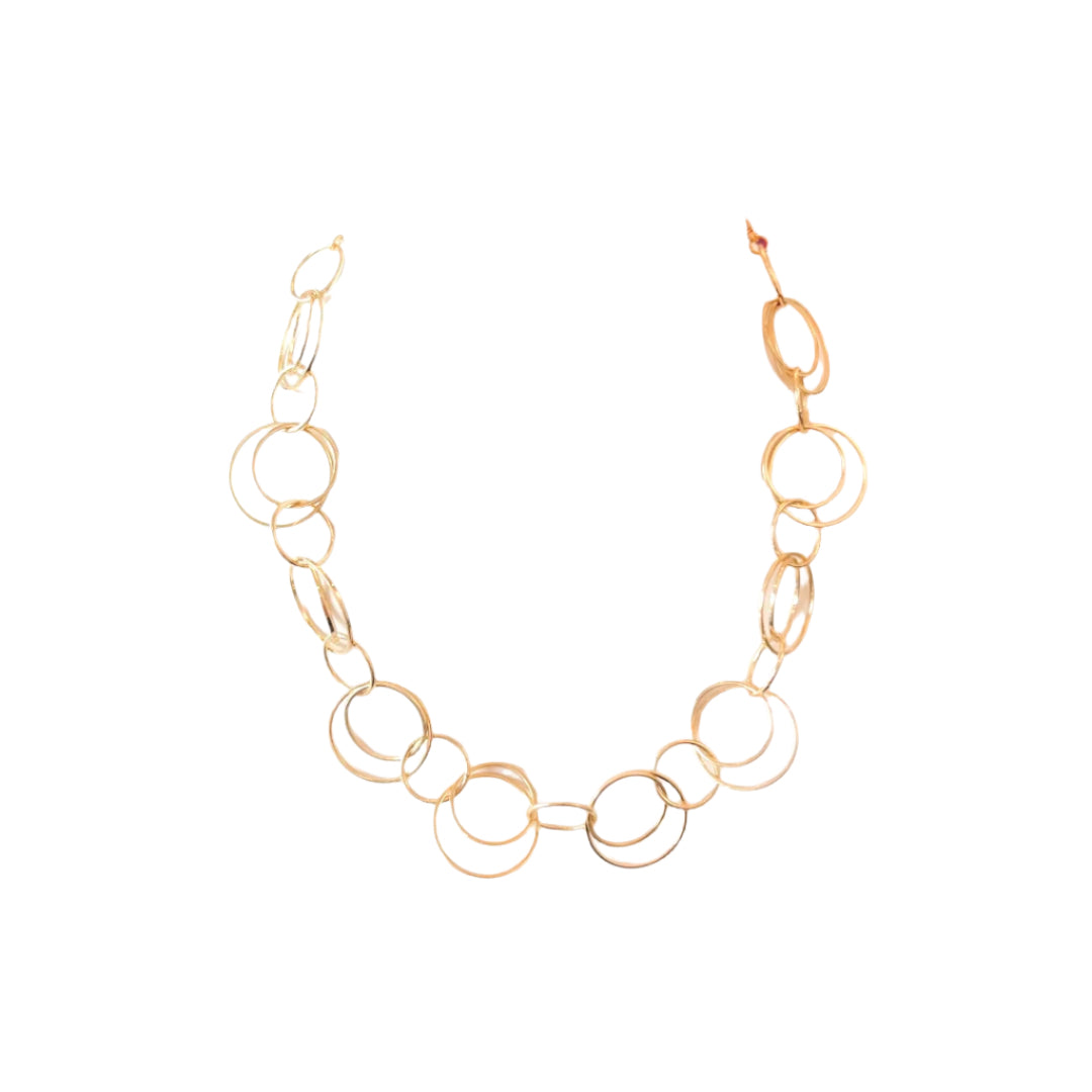 Gold chain necklace on a white stand with a white background