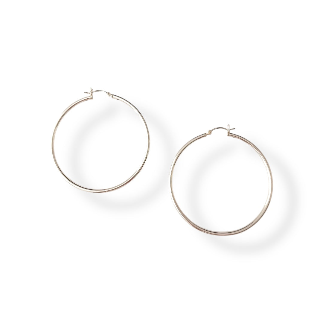 Silver hoop earrings on a white background