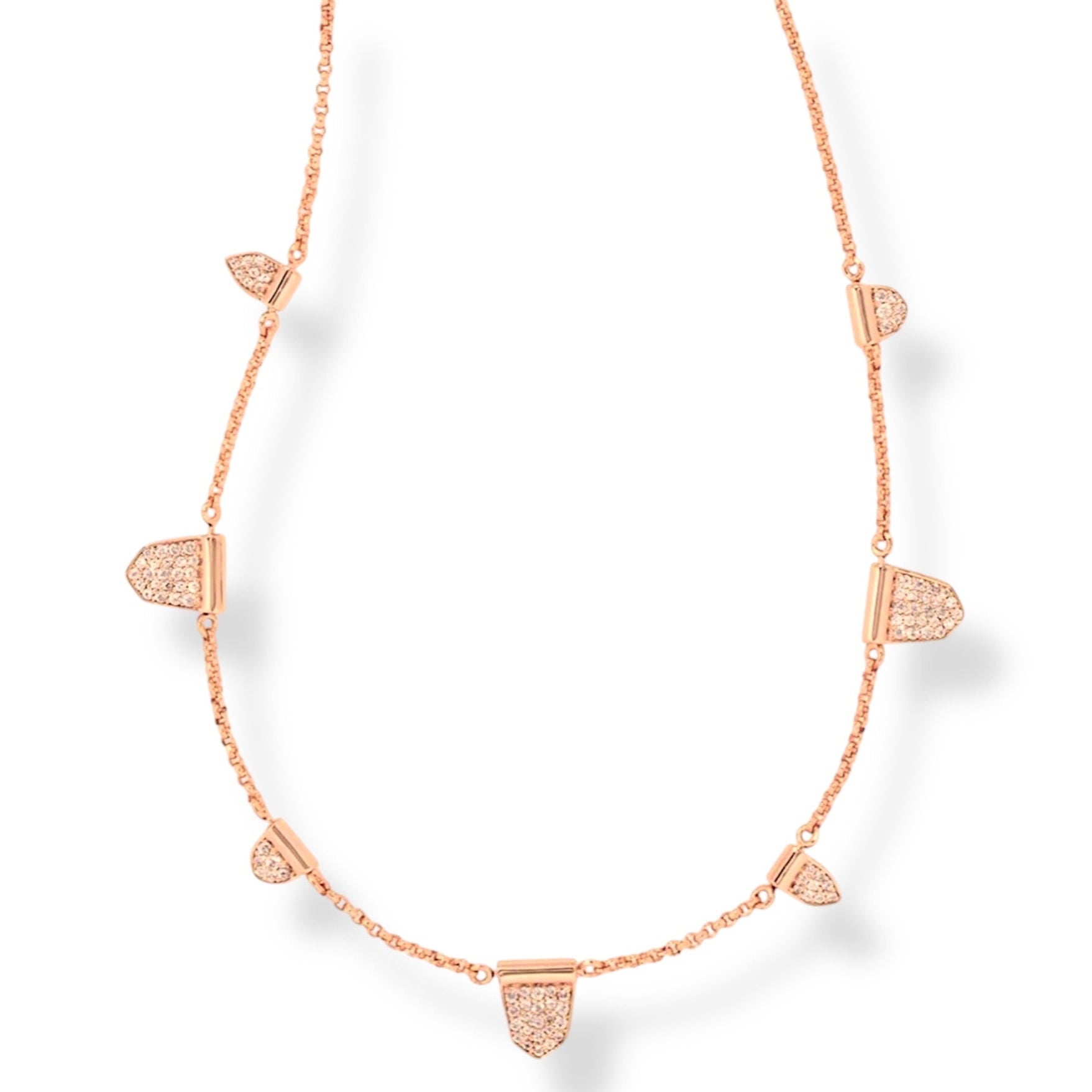Rose gold necklace with geometric pendants on a white background