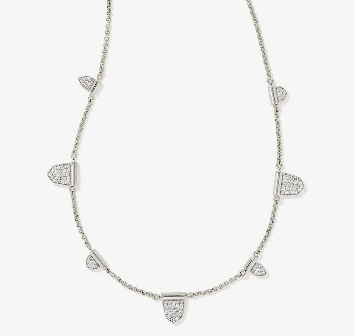 Silver necklace with diamond accents on a white background