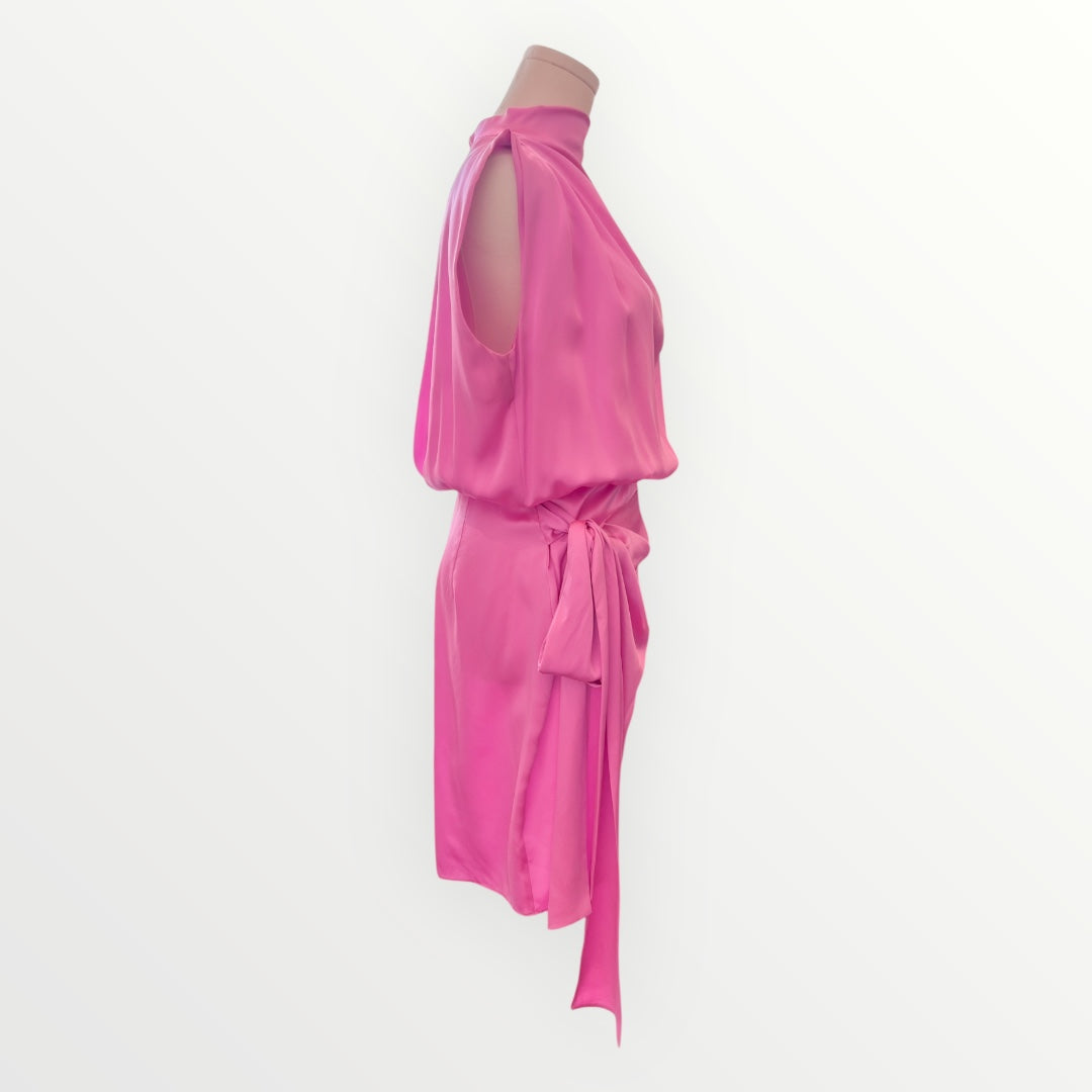Pink dress on a mannequin against a white background