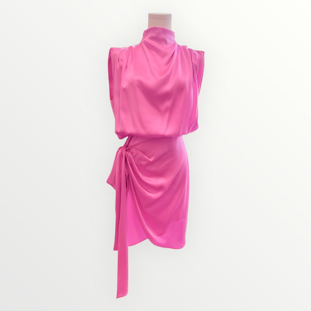 Pink dress on a mannequin against a white background