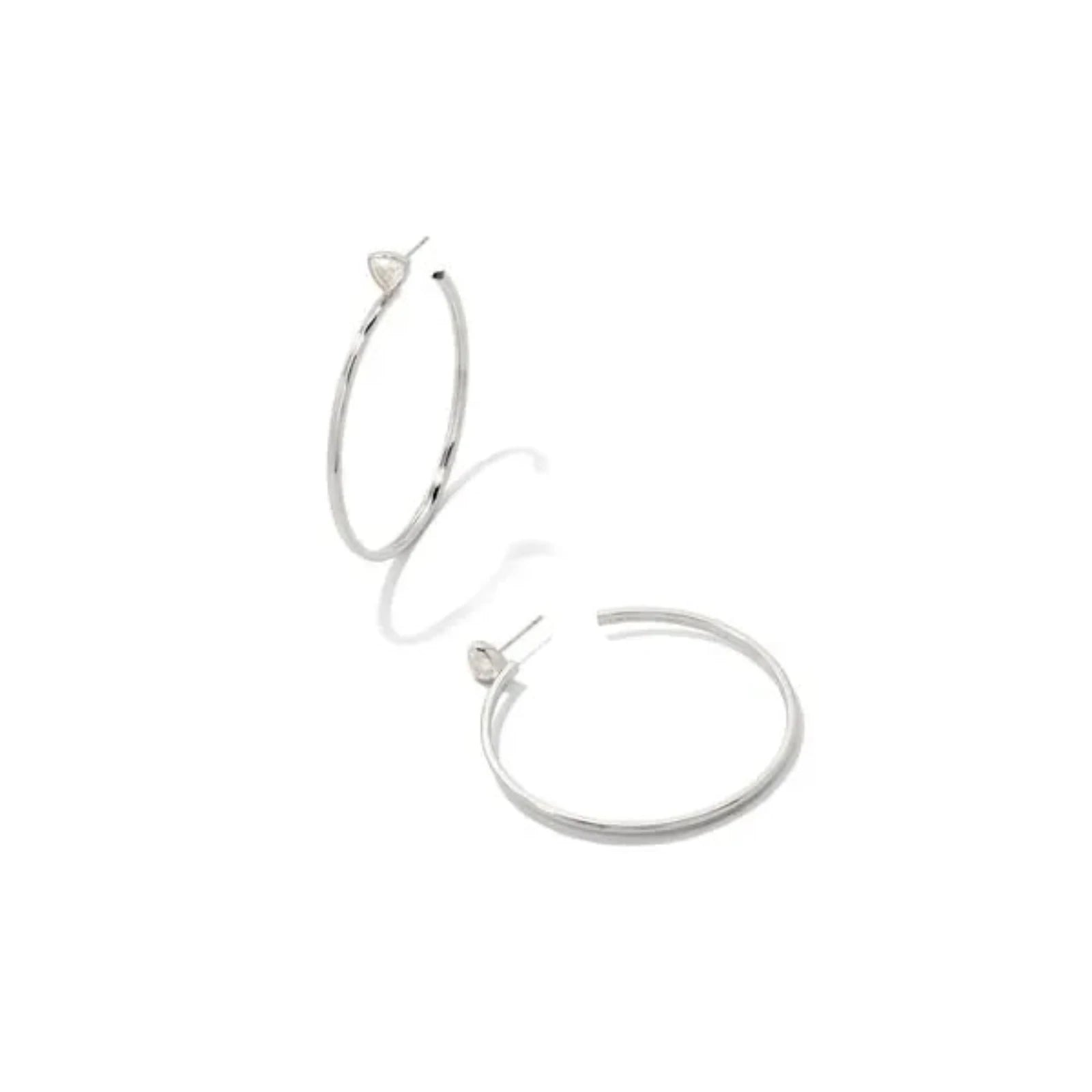 Silver hoop earrings on a white background