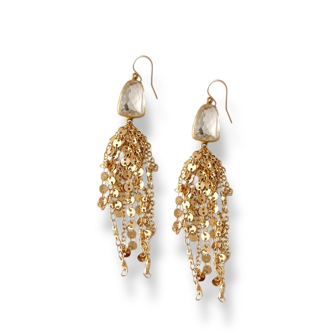 Gold chain earrings with clear gemstones on a white background