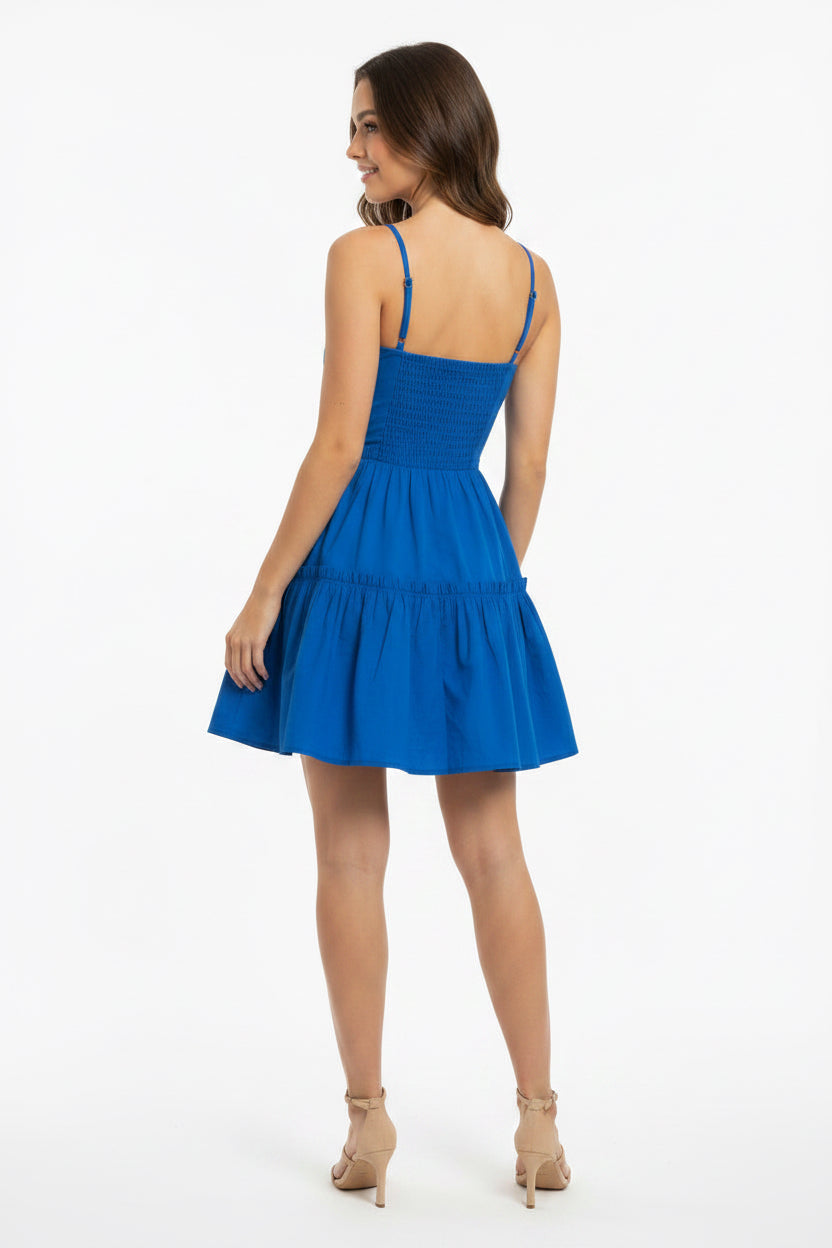 Woman wearing a blue dress on a white background