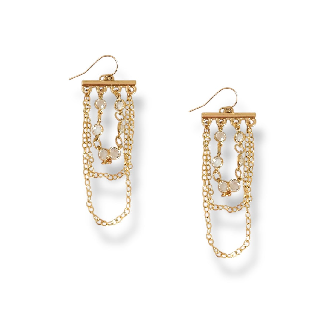 Gold chain earrings on a white background