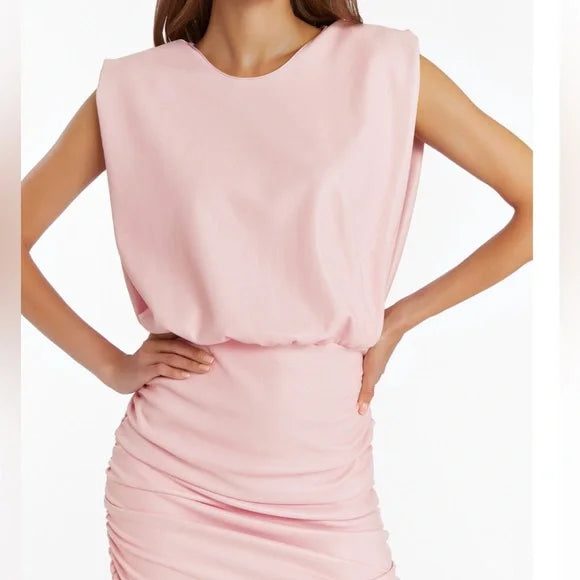 Pink dress worn by a model on a white background