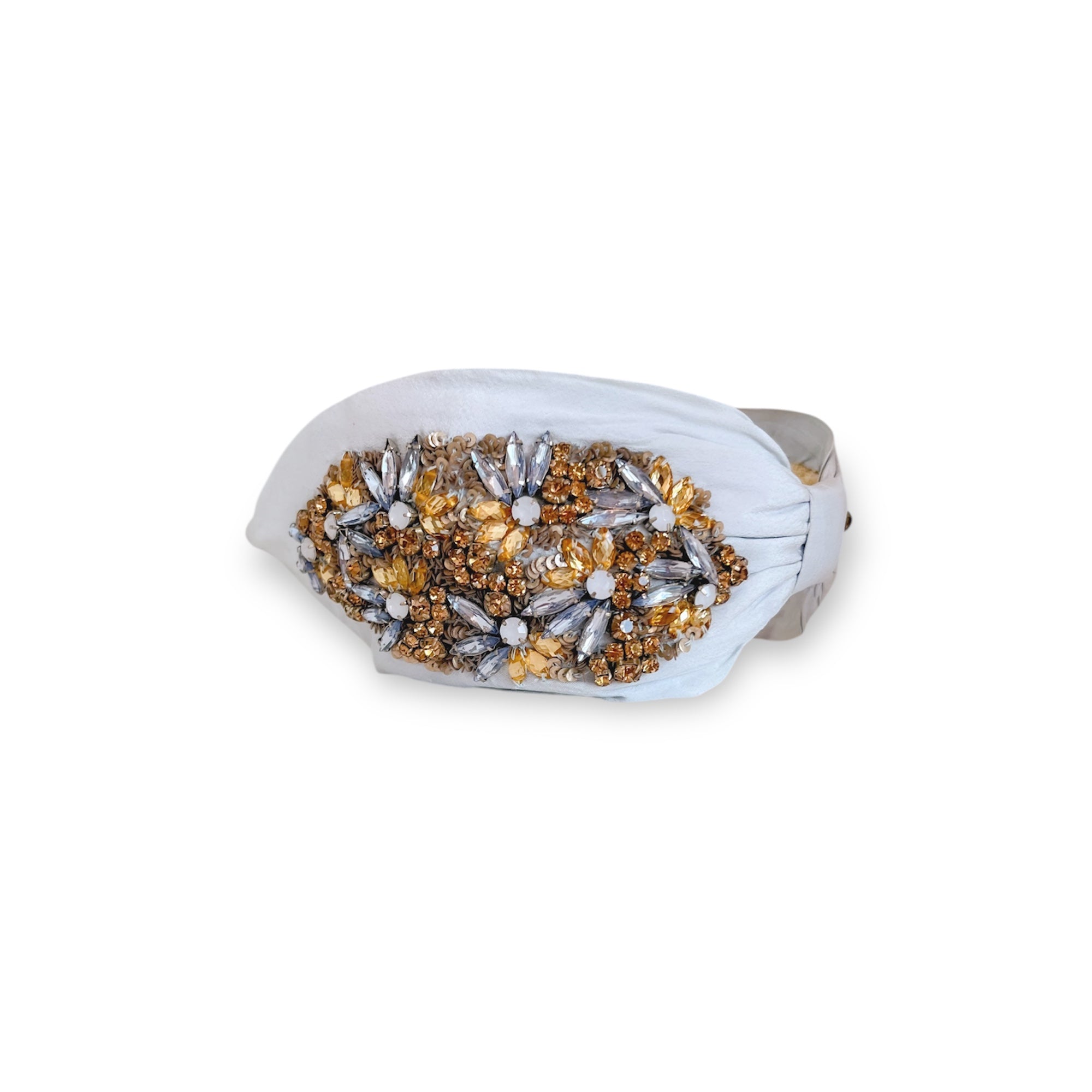 Decorative headband with gold and silver beads on a white background