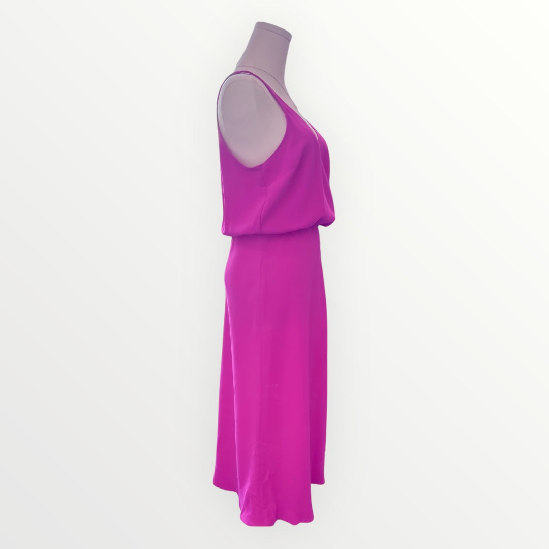 Pink dress on a mannequin against a white background
