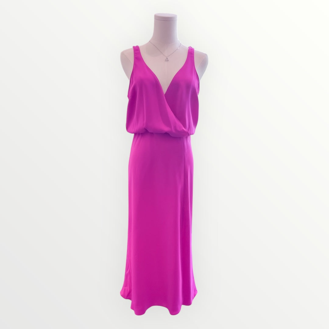 Pink dress on a mannequin against a white background