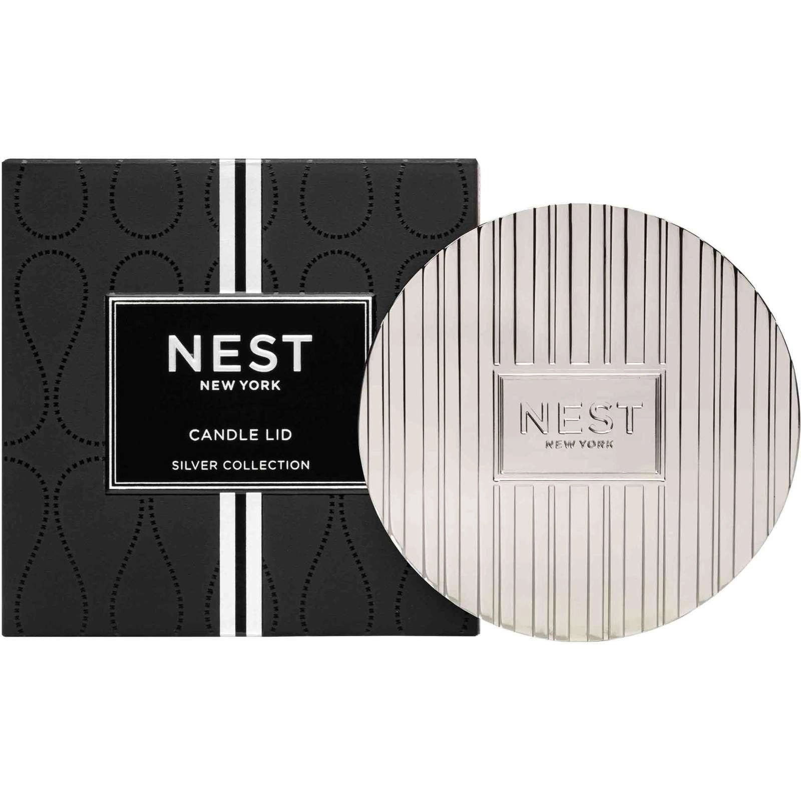 NEST New York candle lid packaging with black box and white lid on a white background