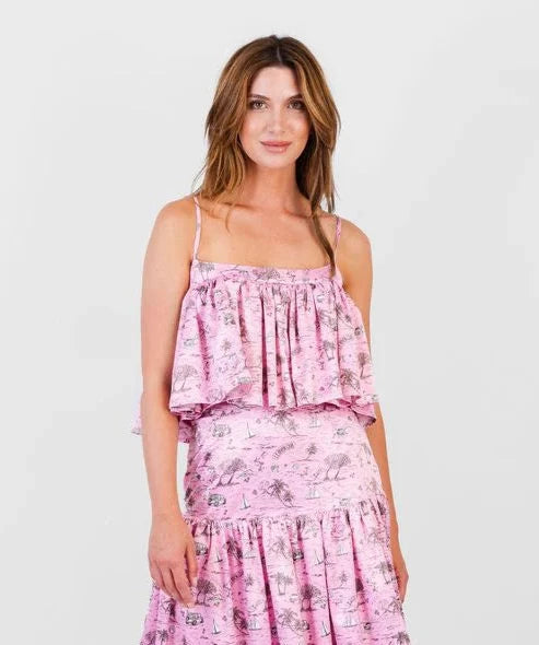 Woman wearing a pink floral dress on a white background