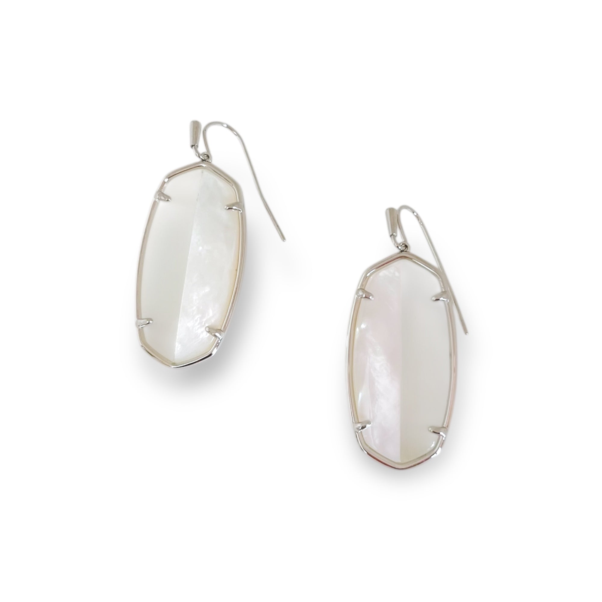 Pair of silver earrings with large, oval-shaped, light-colored gemstones on a white background.