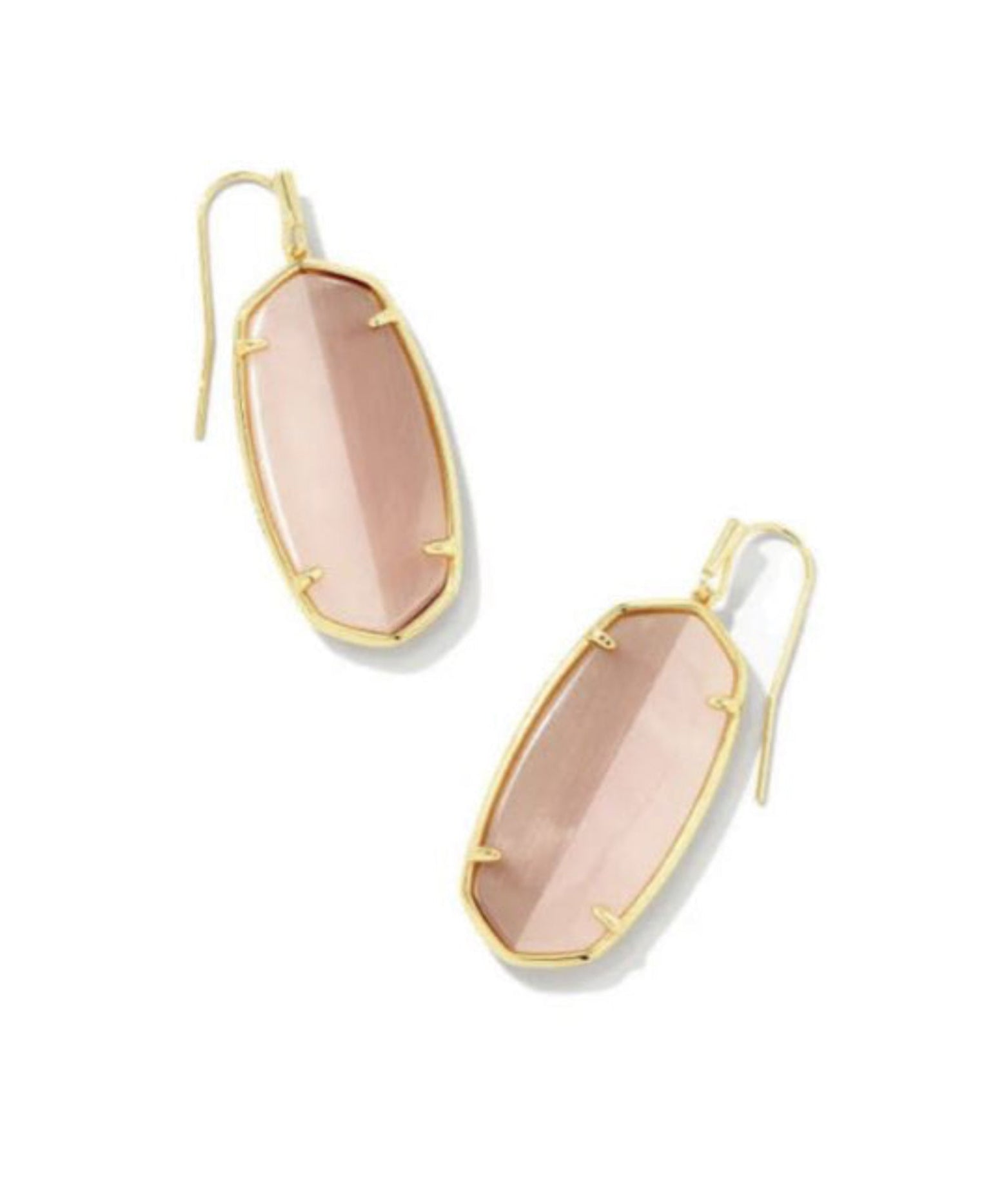 Gold-framed pink earrings on a white background