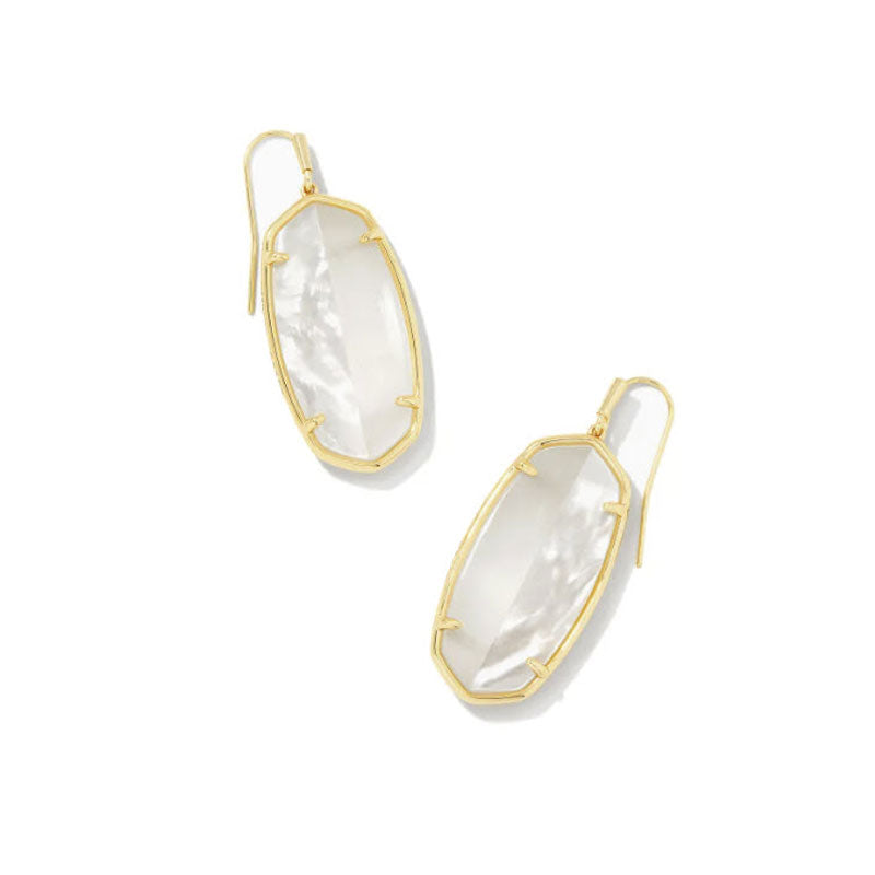 Gold earrings with clear stone on a white background