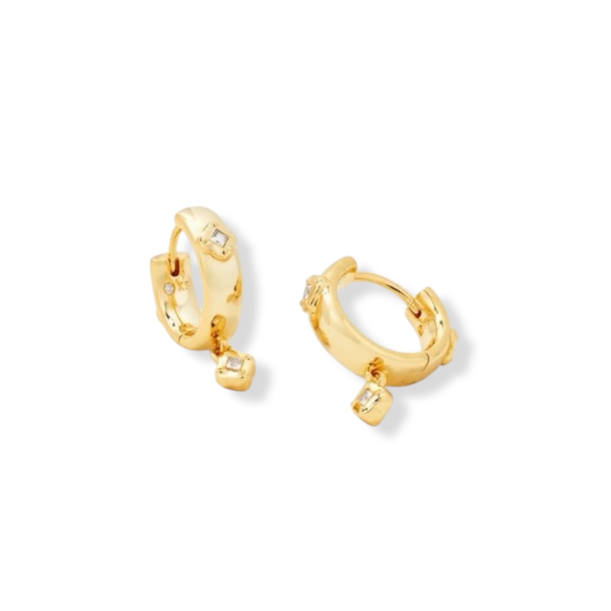 Gold hoop earrings with small square stones on a white background