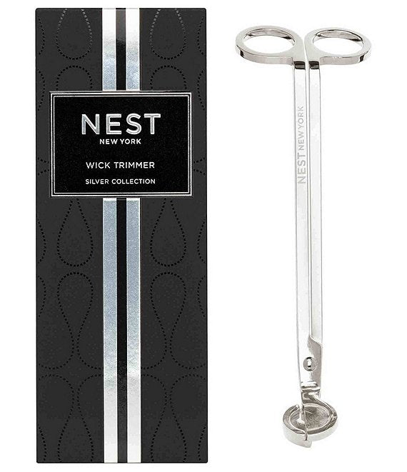 Silver wick trimmer with black packaging labeled 'NEST New York' on a white background