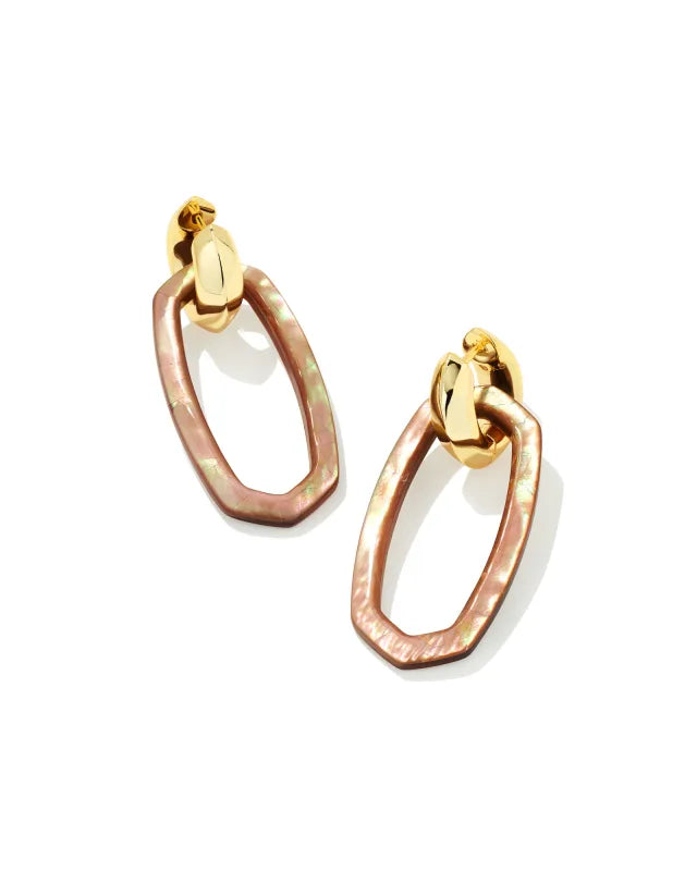 Pair of gold and rose gold hoop earrings on a white background